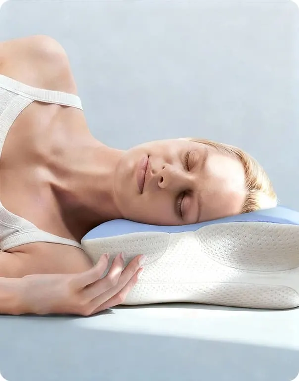 Woman sleeping on her side on the Melara Max contour pillow