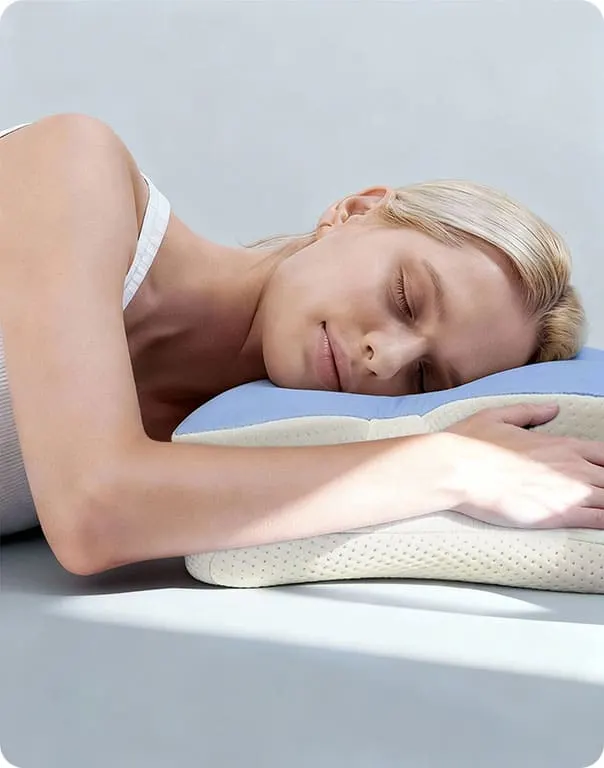 Close-up of the Melara Max pillow cradling the head and neck of a side sleeper